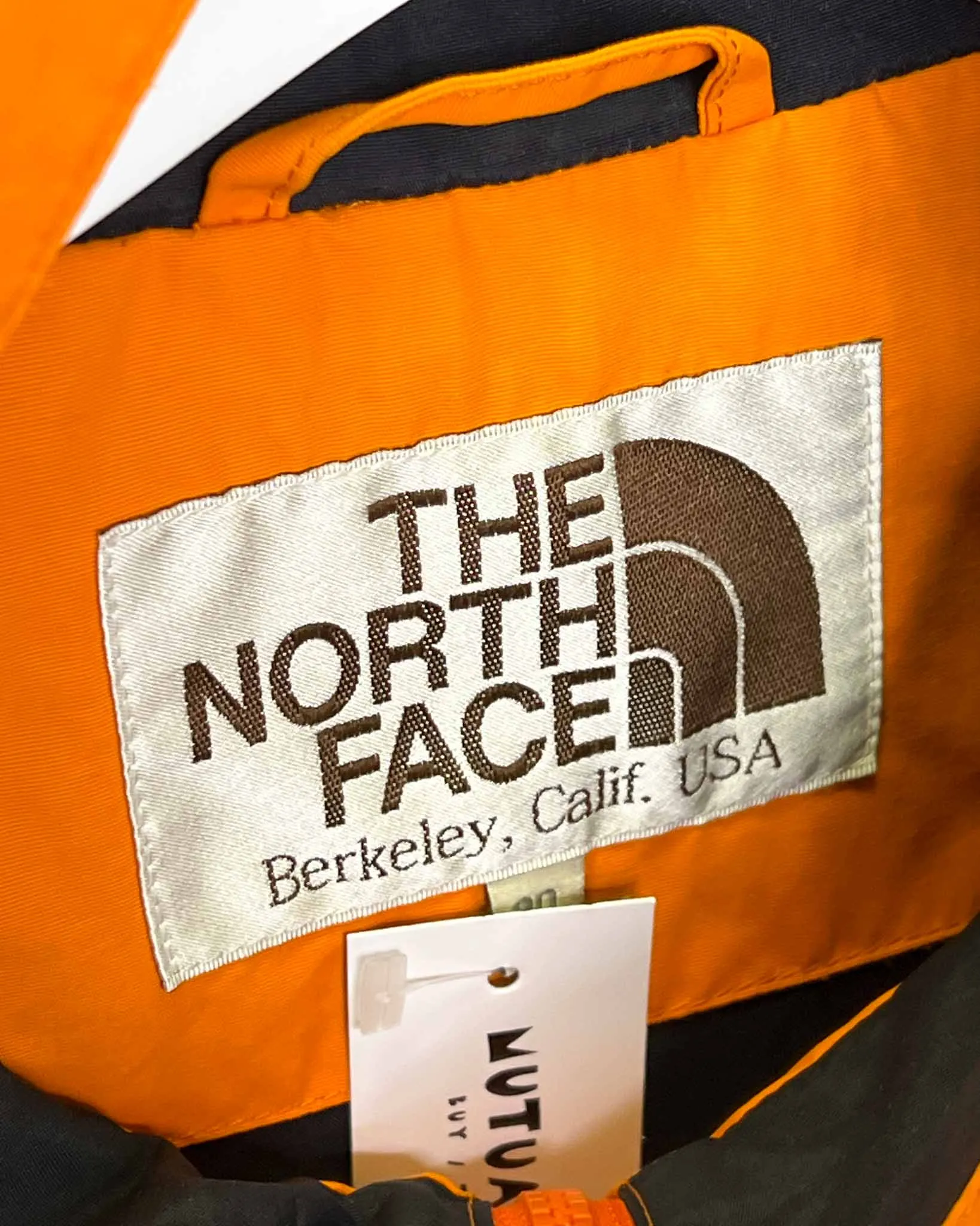 Size L - The North Face Orange Rain Jacket